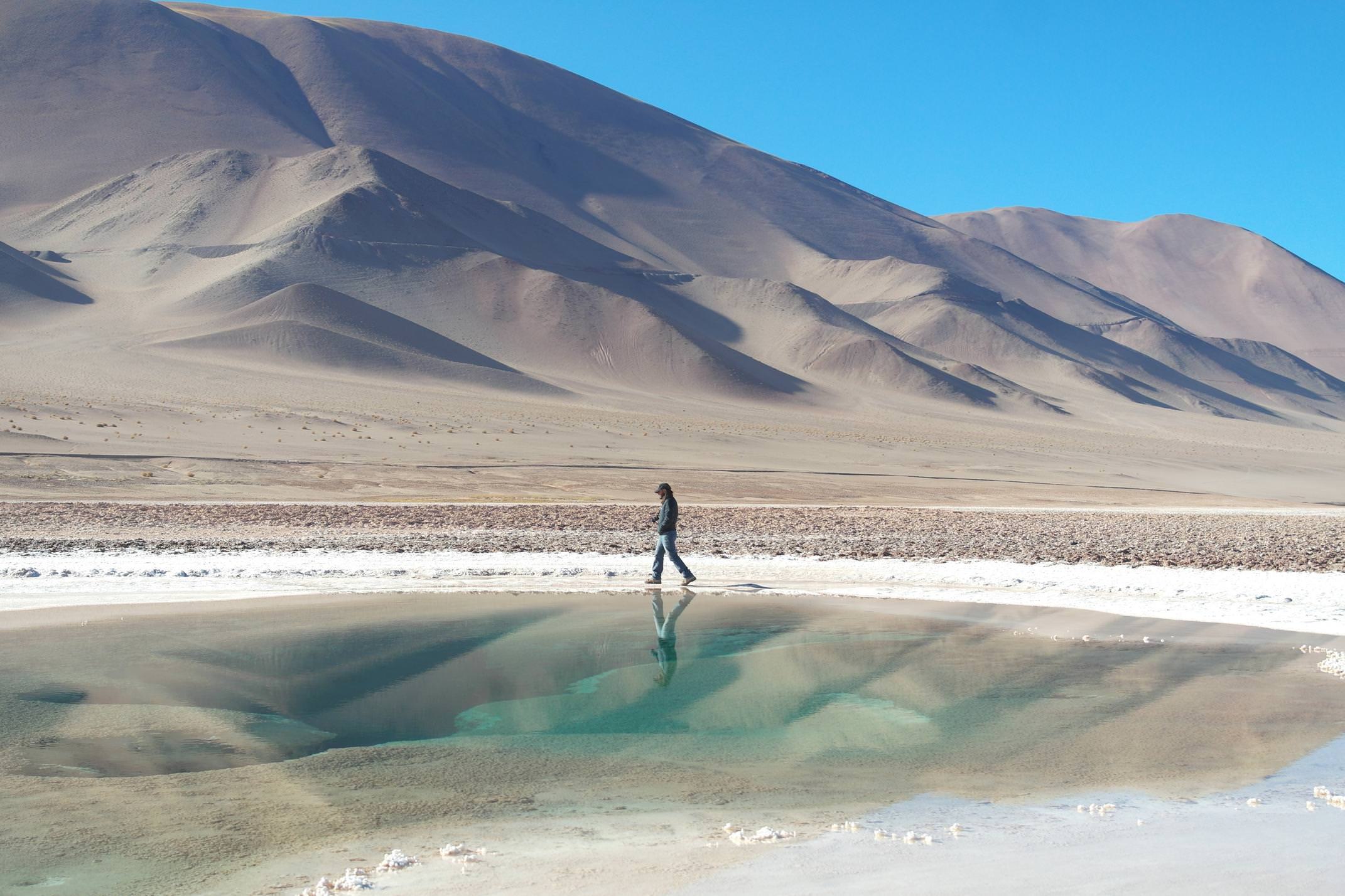 Argentina salta man walking round ojos del mar