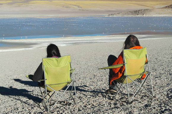 couple sitting on salt flat in argentina