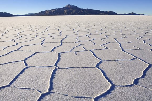 a close up view of the dry white surface of the uyuni salt flat