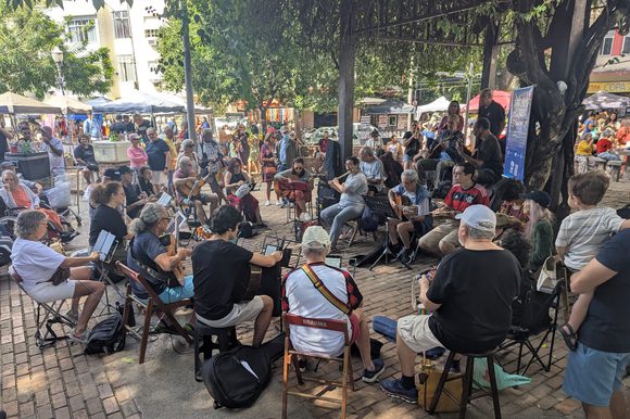 group of choro musicians gathered in a square in rio