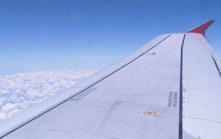 Costa rica plane wing and clouds