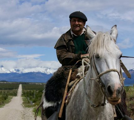 Chile patagonia carretera austral gaucho riding along road lago carrera