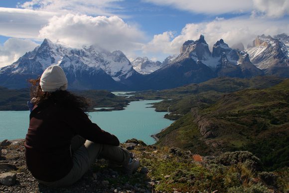 woman looking out over paine massif in patagonia
