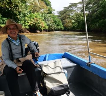 a smiling guide on a boat in the caño negro wildlife reserve