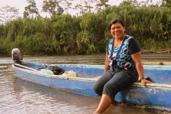 smiling lady with boat in costa rica