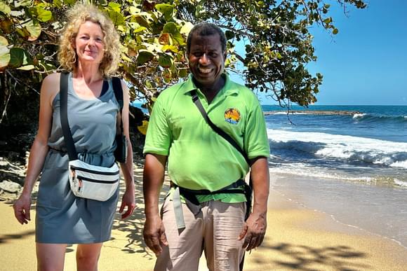 smiling lady and guide on beach in costa rica