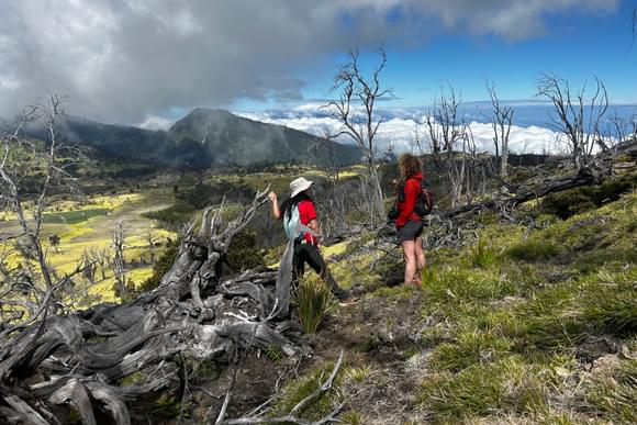 female guide and tourist on top of turrialba volcano amid landscapes shaped by volcanic eruptions