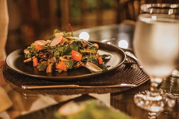 fresh salad on a plate in romantic lighting