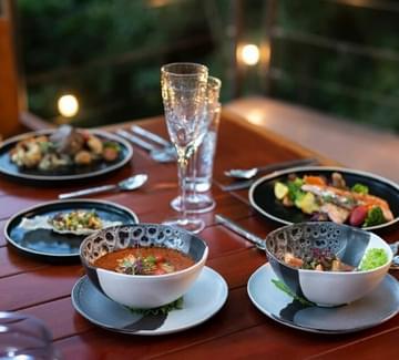 a tasty meal of costa rican food including fresh soup and fish