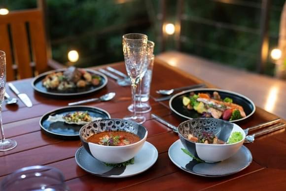 a tasty meal of costa rican food including fresh soup and fish