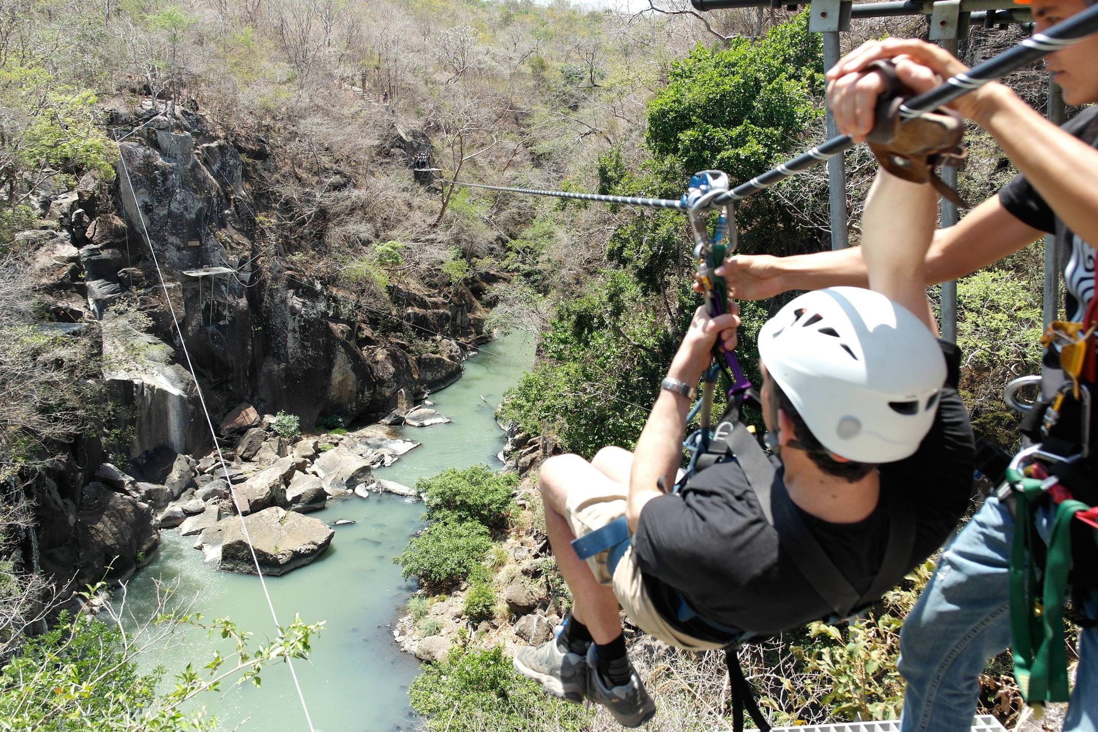 Costa rica tenorio rio perdido canopy tour setting off on zip line