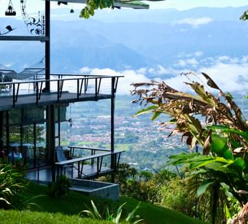 girl in hammock in house above clouds