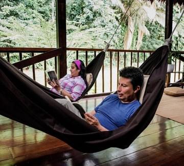 swinging in hammock at amazon lodge in peru