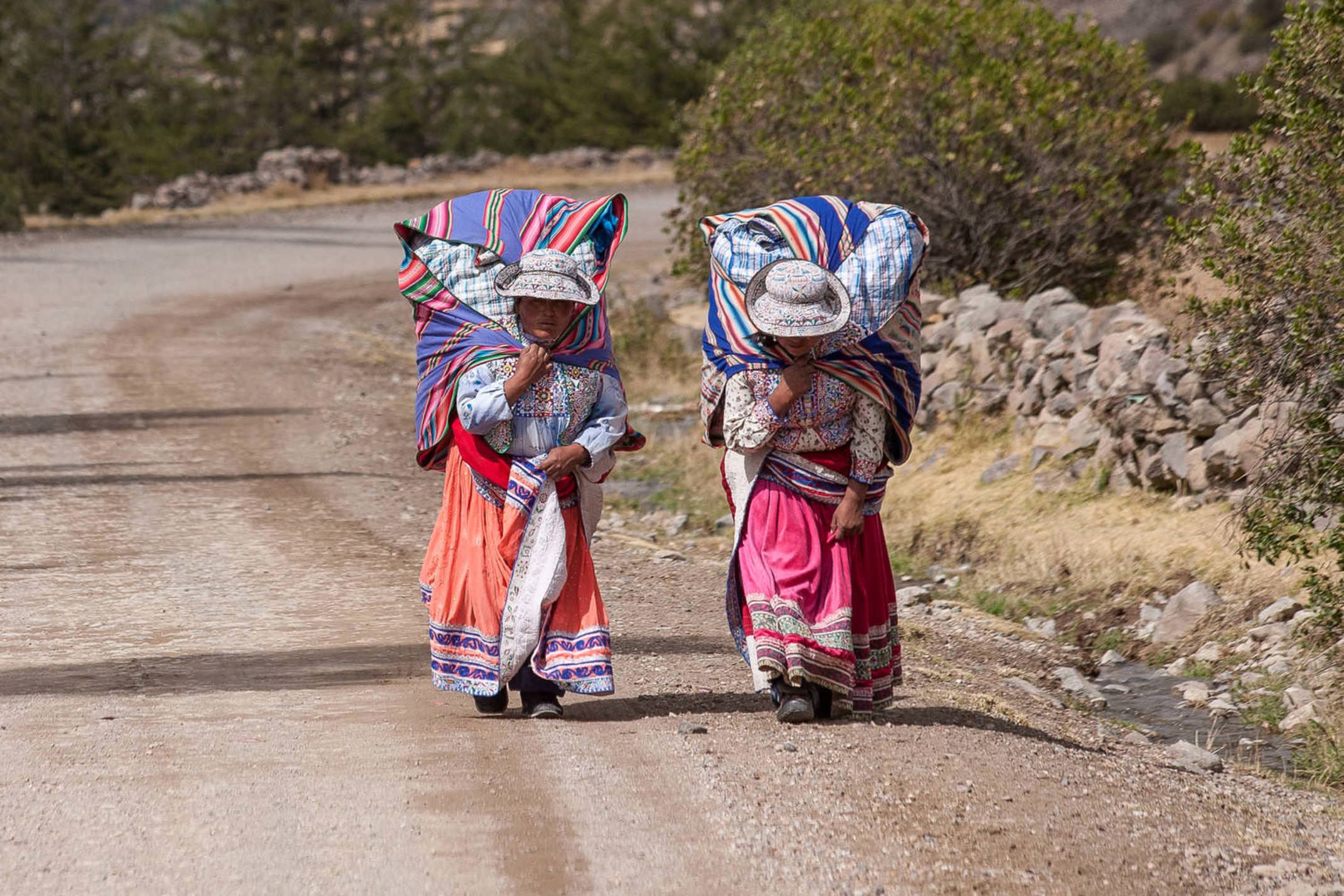 Peru colca canyon not identified women in typical clothes caring souvenirs for sale in her bag circa 2013 in chivay peru