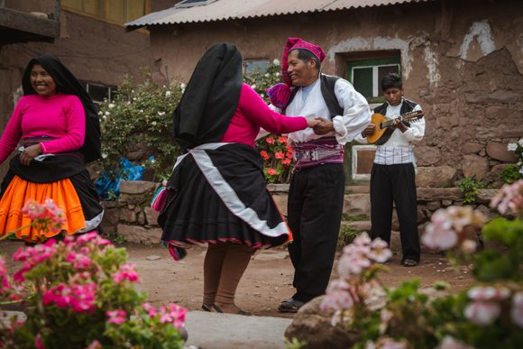 locals dancing in traditional dress n taquile island