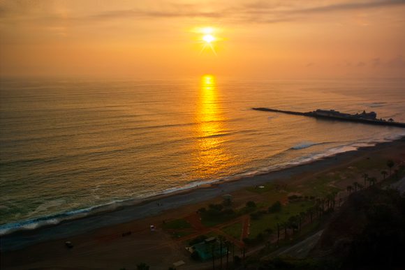 sunset over pacific ocean in lima