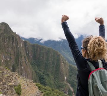 girl arriving at machu picchu