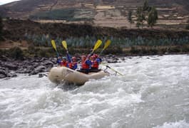 Peru sacred valley group rafting oars aloft