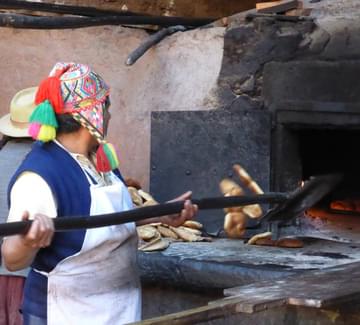 smiling weaver in peru's sacred valley