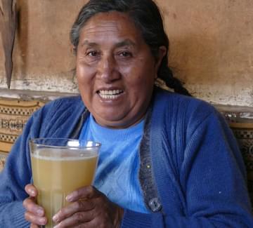 peru andes lady with chicha smiling
