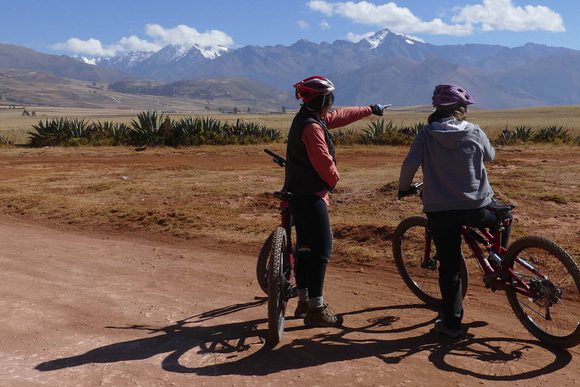 cycling across the chinchero plain in peru's sacred valley