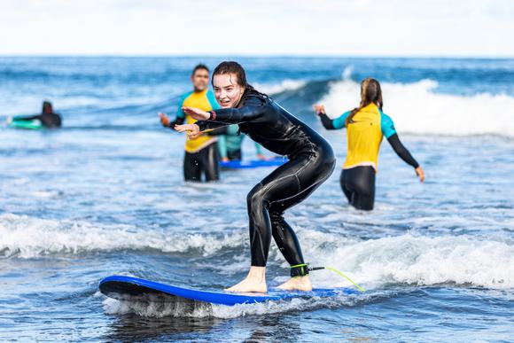 children surfing in the the azores