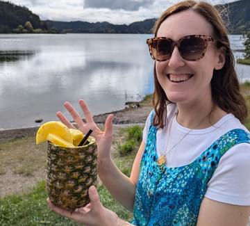 lady with pineapple by lake on sao miguel