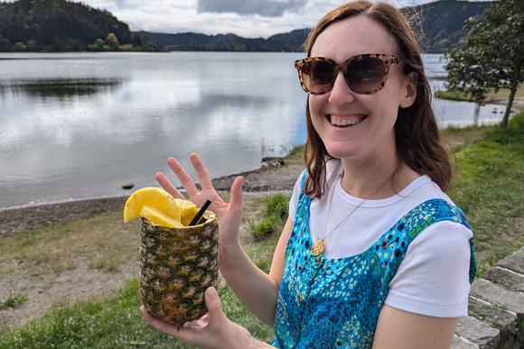 lady with pineapple by lake on sao miguel