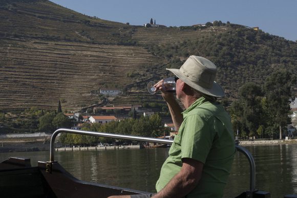 man sipping wine in douro valley