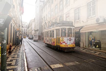 tram in morning sun in lisbon