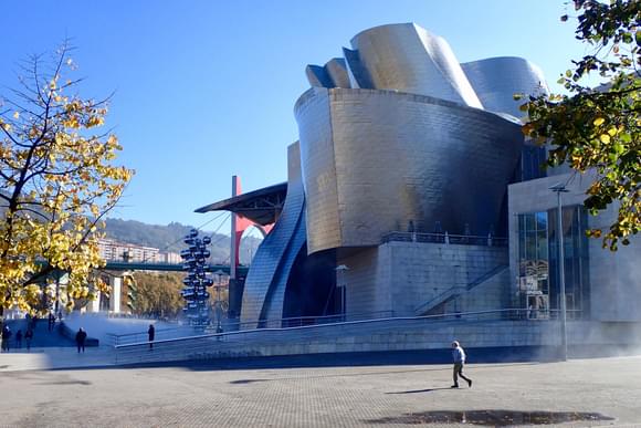 tourist walking past guggenheim museum
