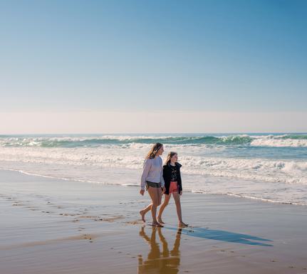 Spain basque country family girls beach surfing istock 1