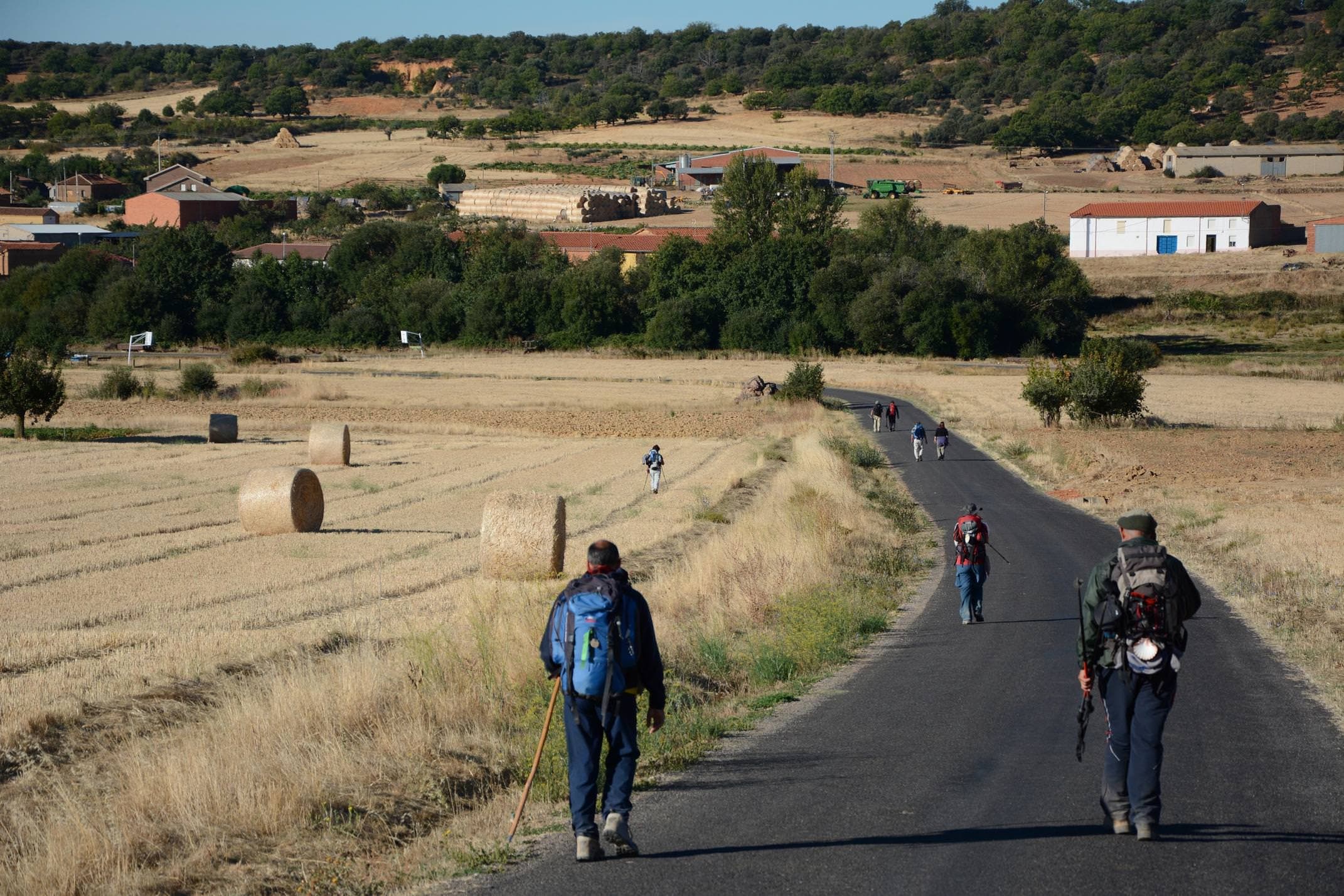 Spain camino de santiago pilgrims on road