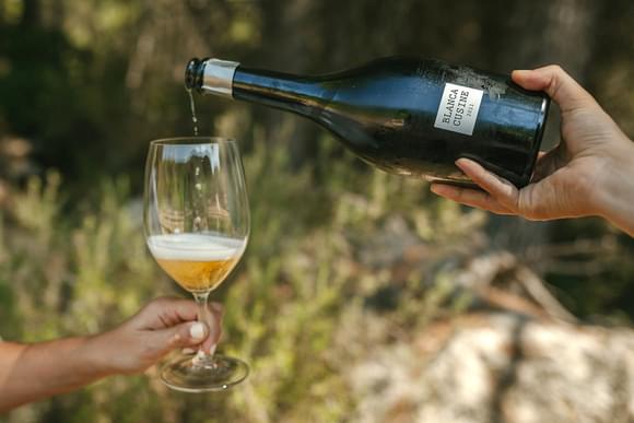 pouring wine in penedes