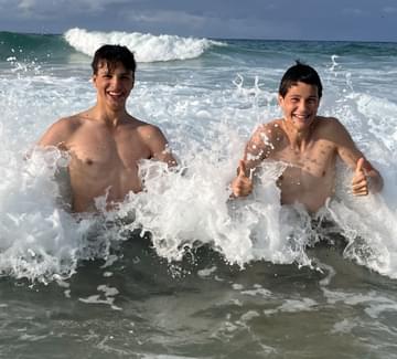 boys swimming in sea in northern spain