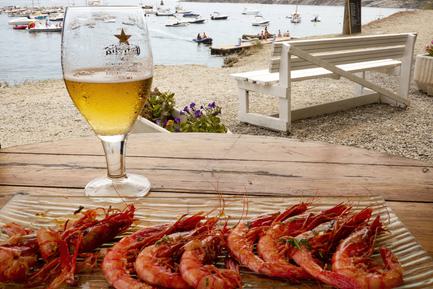 Spain catalonia beer and shrimps cadaques c diego pura