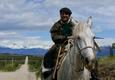 Chile patagonia carretera austral gaucho riding along road lago carrera