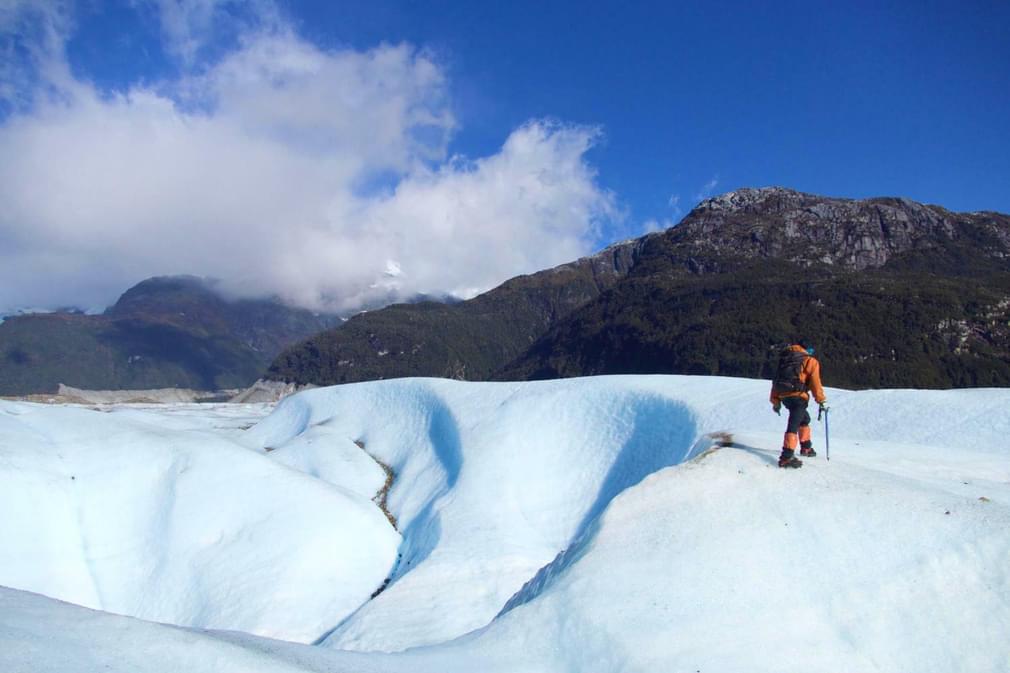 Chile patagonia carretera austral exploradores glacier guide walking onto left hand edge of image 020180829 76980 s3xe4o