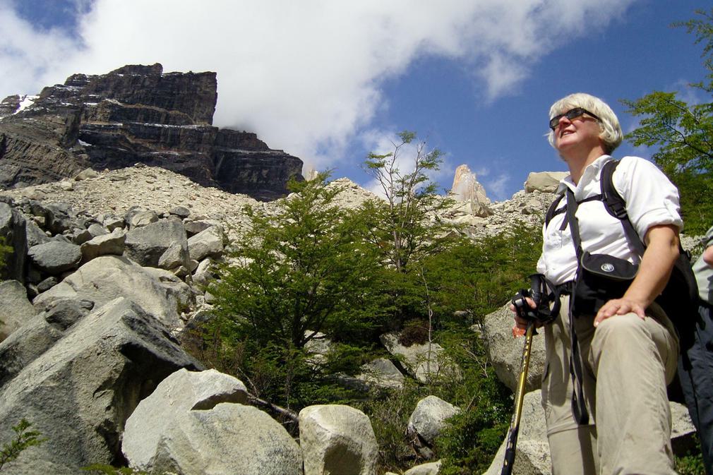 Chile patagonia torres del paine walking woman resting admiring mountains