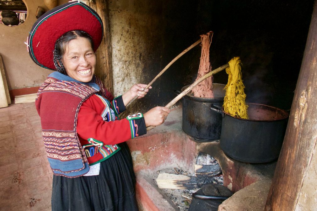 Peru sacred valley chinchero weaver dying wool over stove20180829 76980 ix9fjt